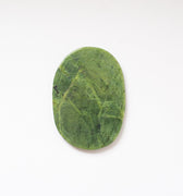 Top view of a slice of nephrite jade.