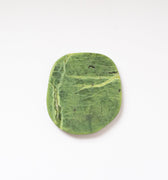Top view of a slice of nephrite jade.